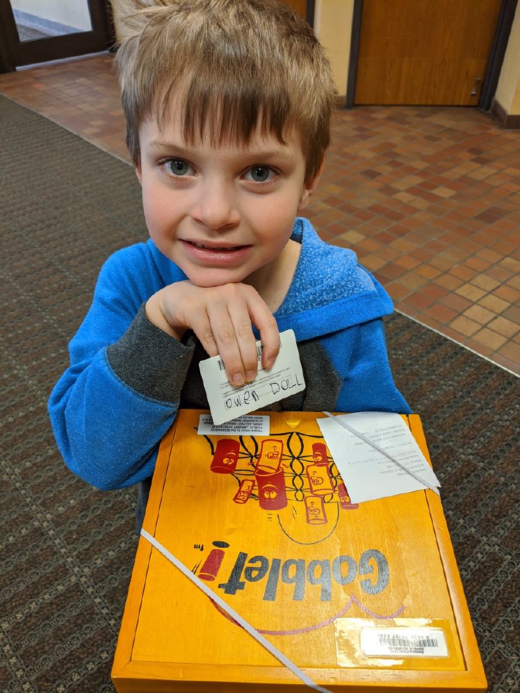 Owen showing off his card and first item checked out.