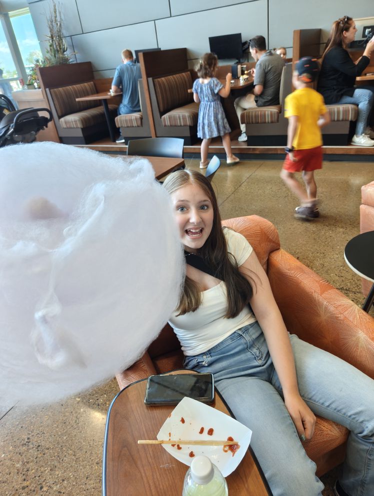 Ella surprised at how big the cotton candy actually was!